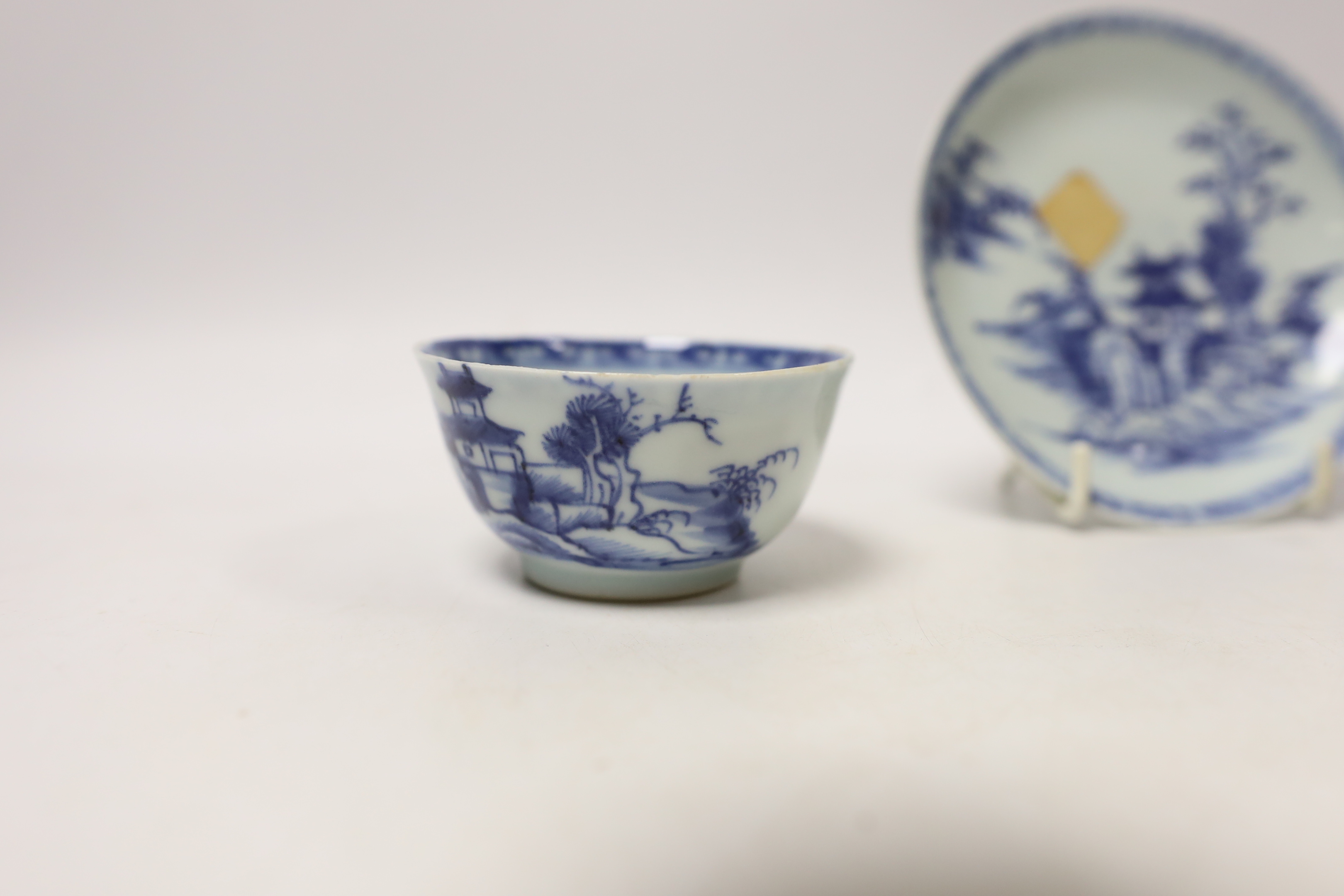 A Chinese Nanking Cargo blue and white saucer and tea bowl, and a Kangxi blue and white tea bowl, largest 11.5cm in diameter